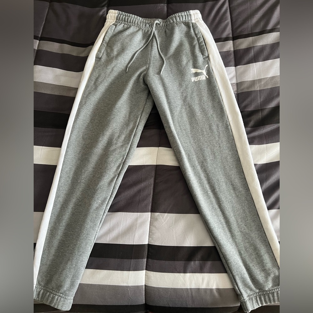 Up for sale are a pair of gray Puma joggers. Size small.